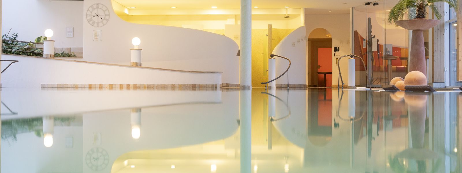 Symmetrical reflections on the water surface in the Hotel Deimann swimming pool