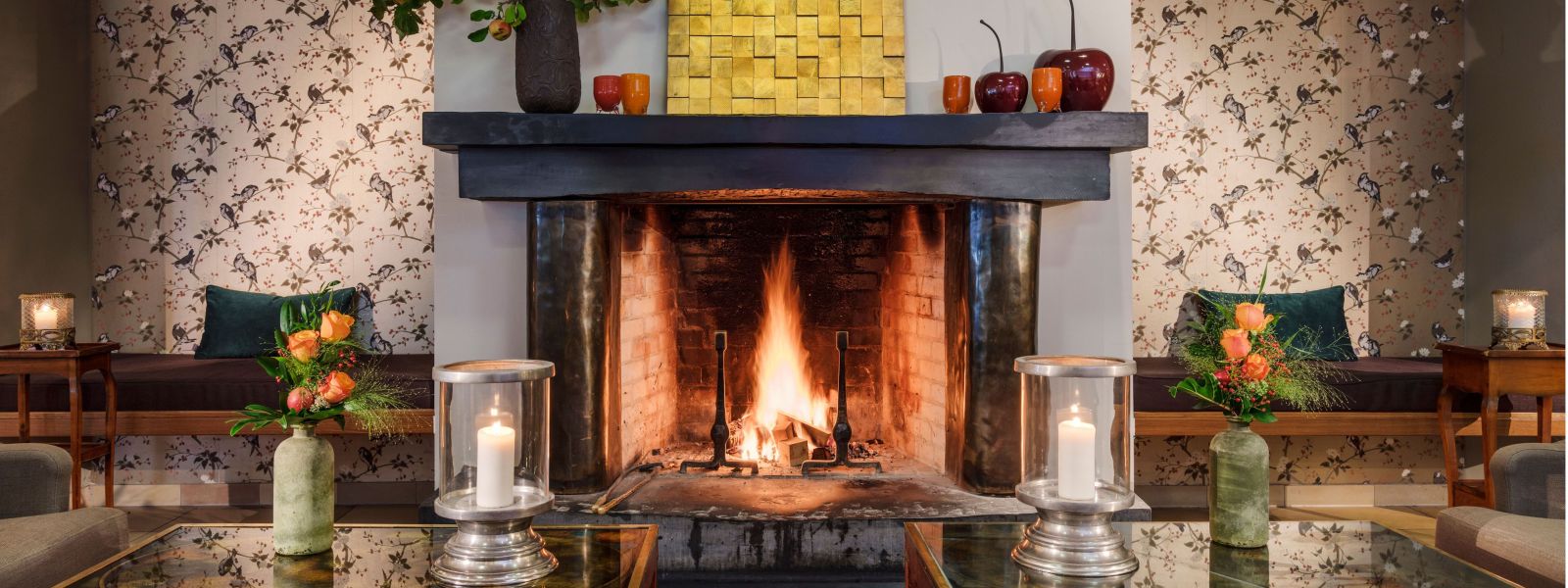 Burning fireplace and seating areas in the hotel lobby