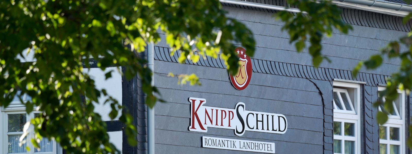 Hotel logo on the outside of the building